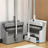 A pair of silver and white folding broom and dustpan sets with aluminum handles resting on a wooden floor.