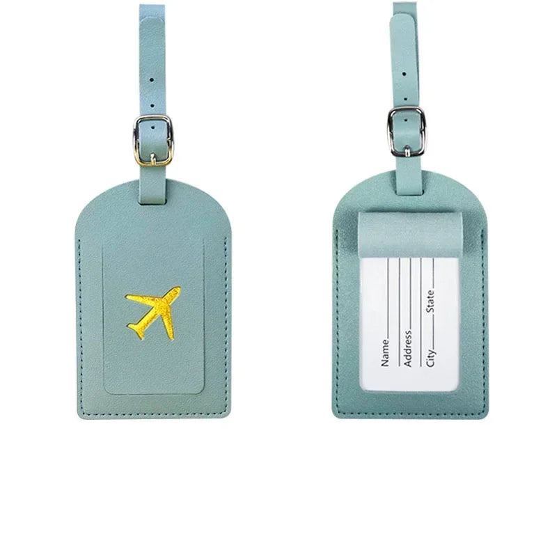 A light mint green PU leather luggage tag with a gold airplane emblem and a clear section for address details.