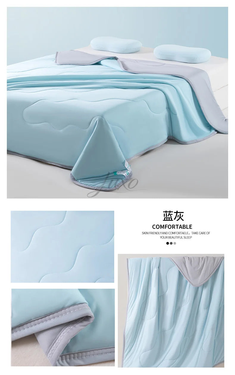 Light blue ice silk cooling blanket draped on a bed, showing its soft texture and folds.