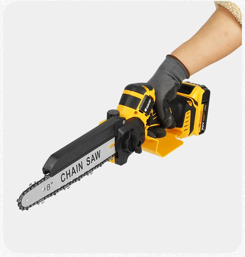 A hand holding a yellow cordless brushless chainsaw with a chain saw blade for wood cutting.