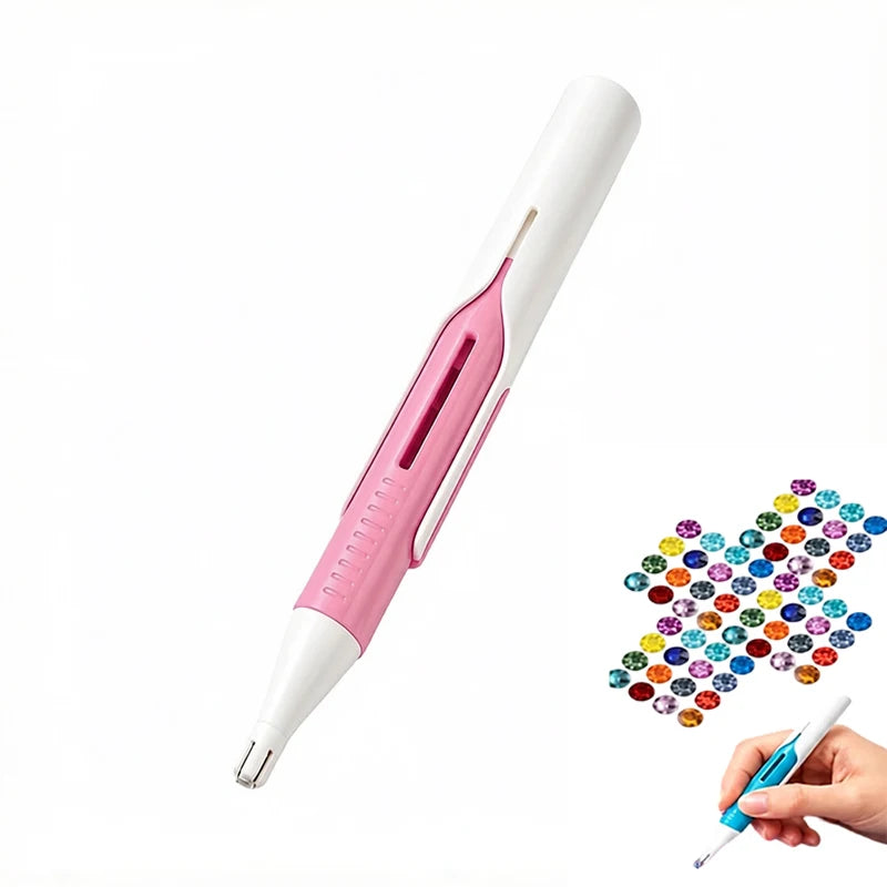 A pink and white automatic diamond painting bead dispenser pen with a precision tip being held by a hand.
