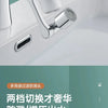 A close-up view of a modern chrome faucet extender and spray head installed in a white bathroom sink.