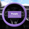 Purple silicone steering wheel cover for a car, showing the grip and rim.