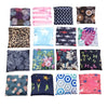 A collection of colorful patterned fabric pouches and bags.