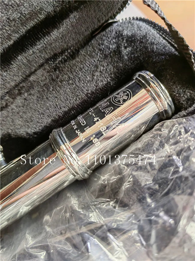 Silver-plated 16-hole flute in C key with E mechanism inside a black padded case.
