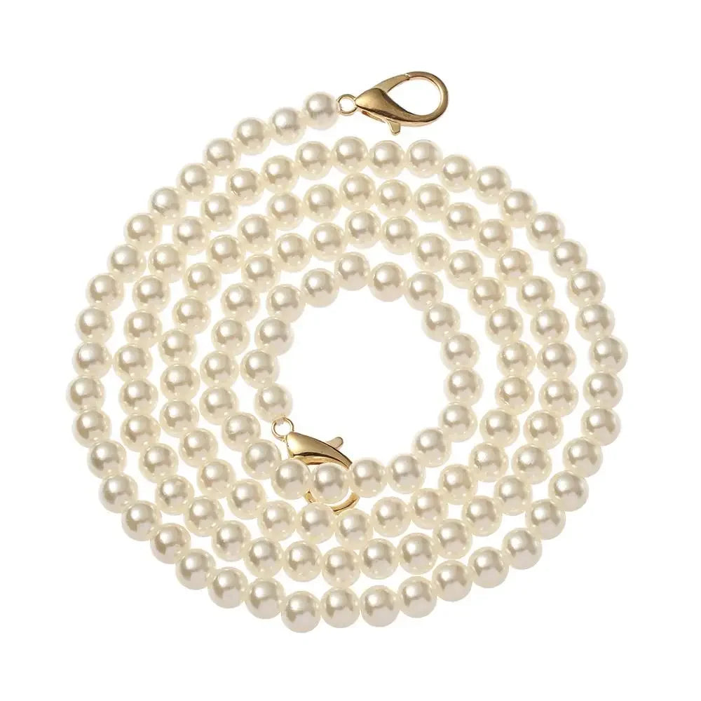 A strand of small, round white pearls used as a strap replacement for handbags.
