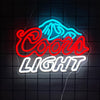 An LED neon sign shaped like a stylized animal head and the words COCOA LIGHT glowing in blue and red on a dark surface.