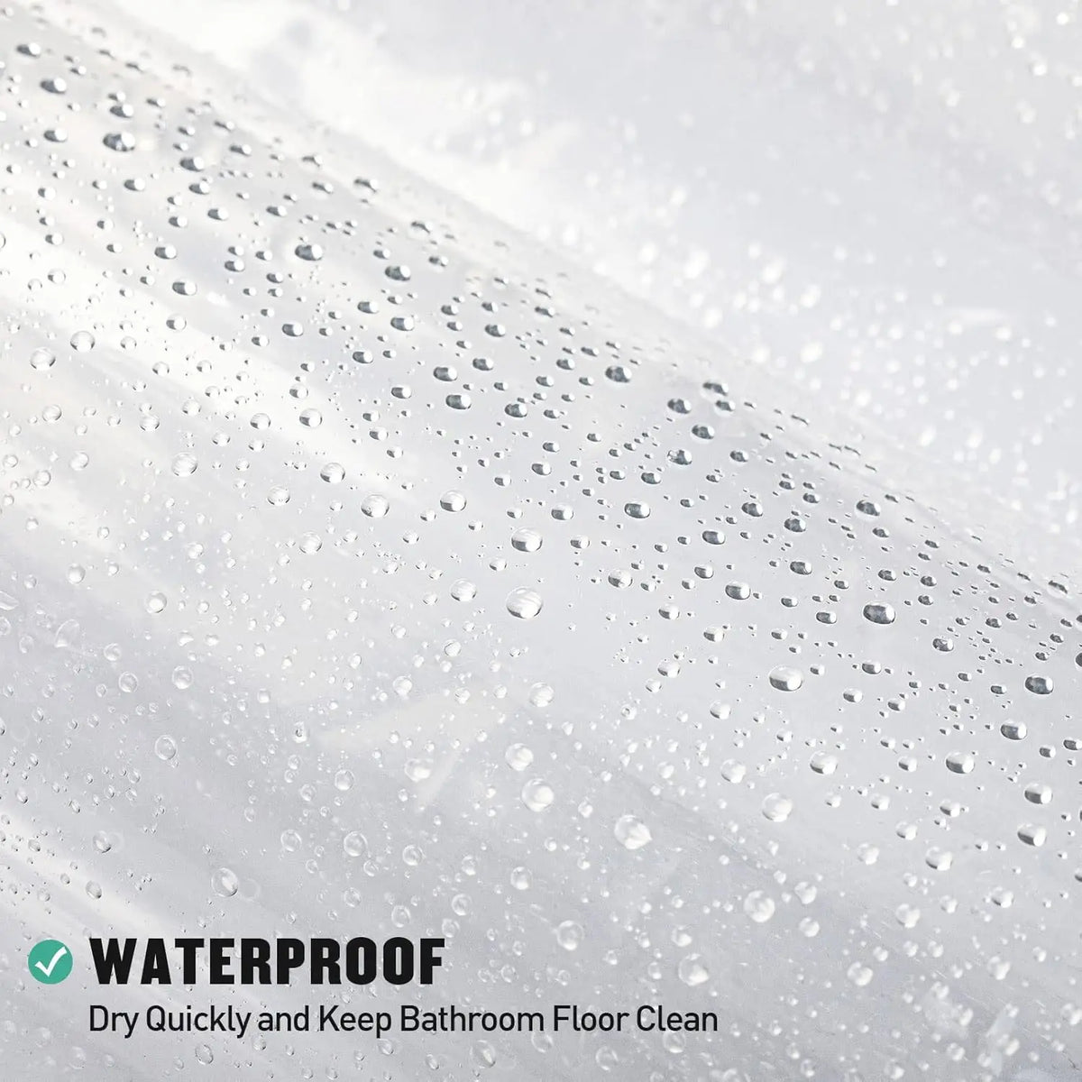 Close-up of a clear shower curtain liner with magnets showing water beading on a surface.