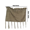 A plaid oven skirt in olive green and beige tones with a ruffled trim and hanging ties.