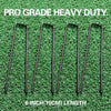 Six 6 inch galvanized U-shaped garden staples lying on green grass.