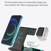 A black foldable wireless charging station is shown with a smartphone, Apple Watch, and AirPods placed on it for inductive ch