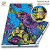 A vibrant blue fabric featuring a floral pattern with purple, yellow, and green accents.