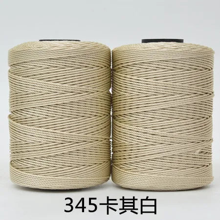 Two spools of beige 3-ply polyester knitting yarn for crochet and hand crafts