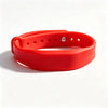 A bright red silicone wristband with a cutout for a finger is shown on a white background.