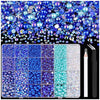 A flatback craft kit featuring various blue and purple pearls and rhinestones, along with a tweezer and picker tool.