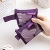 A hand holds a purple mesh storage bag with a zipper, showing transparent mesh bags for organizing small items.