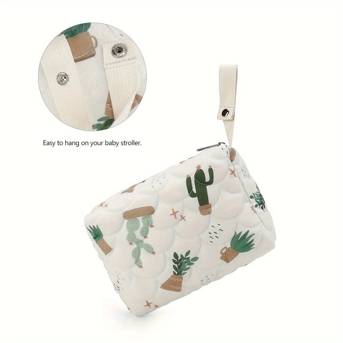 A beige fabric diaper caddy organizer with a white background and green cactus print, showing how to hang it on a stroller.
