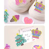 A DIY beaded pen craft kit featuring princess and rainbow designs on a light pink and white silicone mold.