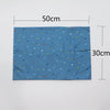 A rectangular blue soft cotton baby pillowcase featuring a pattern of small colored cartoon hearts and shapes.