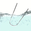 A stainless steel tongue scraper is shown dipping into clear water, creating ripples and bubbles.