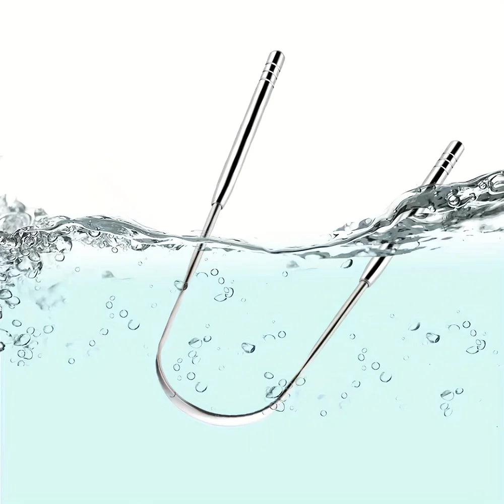 A stainless steel tongue scraper is shown dipping into clear water, creating ripples and bubbles.