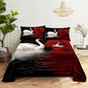 A bedding set featuring a digital print of red roses and white swans on a black background.