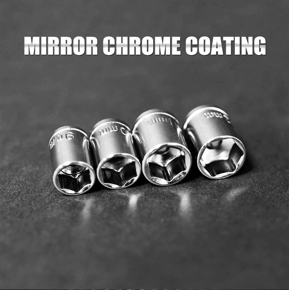 A close-up photo of four mirror chrome coated sockets and wrenches resting on a dark surface.