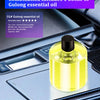 Une bouteille jaune d'huile essentielle de Gulong sur une surface sombre de voiture.