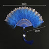 A vibrant blue lace folding hand fan with a feathered edge and a tassel, shown against a black background.