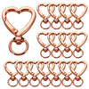 A set of rose gold heart-shaped spring hook keychains for keys, bags, and luggage.