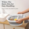 A hand is holding a wide basin rim for easy handling, demonstrating the product's design.