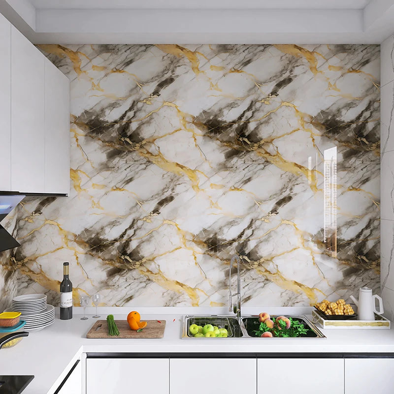 Marble pattern peel and stick self-adhesive wallpaper featuring gray and gold veining on a kitchen backsplash.