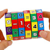 A set of colorful Montessori math cubes displaying numbers and basic arithmetic operations like addition, subtraction, multip