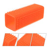 Orange silicone pet hair remover brush with a textured surface shown from the side and angled views.