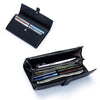 A black women's cowhide leather bifold wallet shown open, displaying various cards and cash.