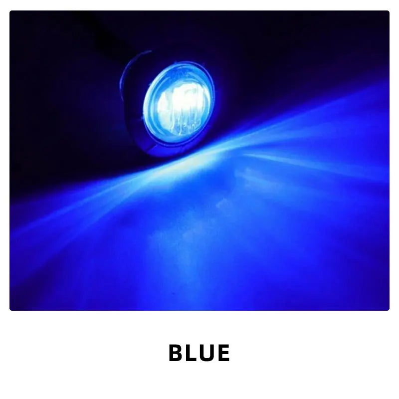 Blue LED side marker light shining a bright beam in a dark environment.
