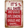 A distressed red metal sign with white text that reads It's all shits and giggles until someone giggles and shits.