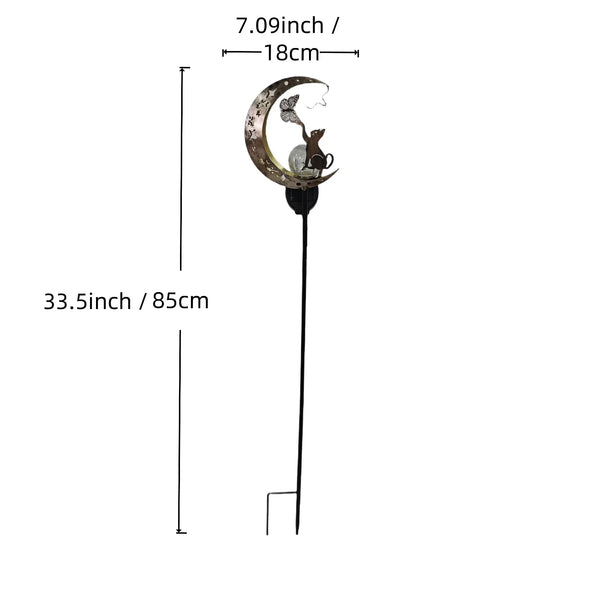 A tall, slender solar garden light featuring a crescent moon design and a small silhouette of a cat.