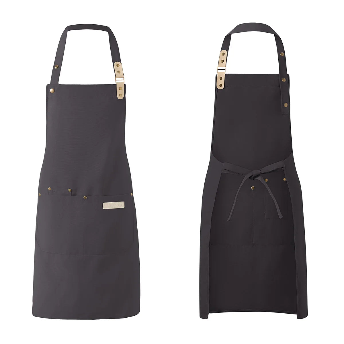A dark gray waterproof canvas chef apron with wooden toggles and a gathered waist.