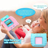 A woman is showing a pink talking flash card learning toy to a young child.
