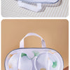 A white mesh laundry bag with a handle is shown against a beige background.