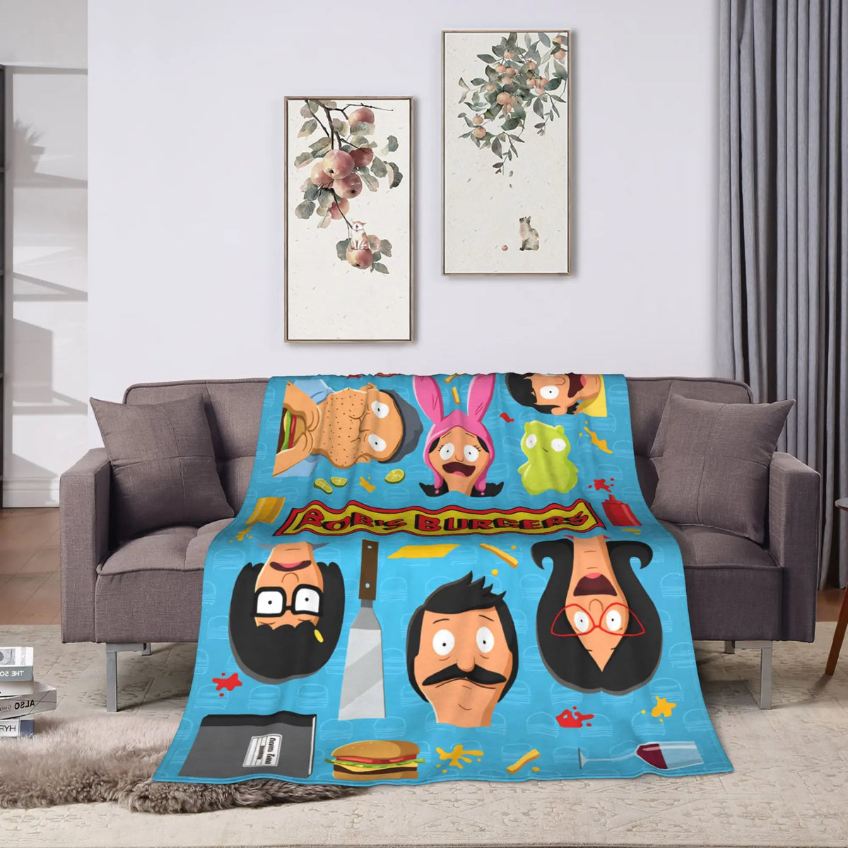 A colorful cartoon-themed throw blanket featuring playful animal characters and food items.