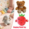 A fluffy brown teddy bear plush toy and a red strawberry plush toy.