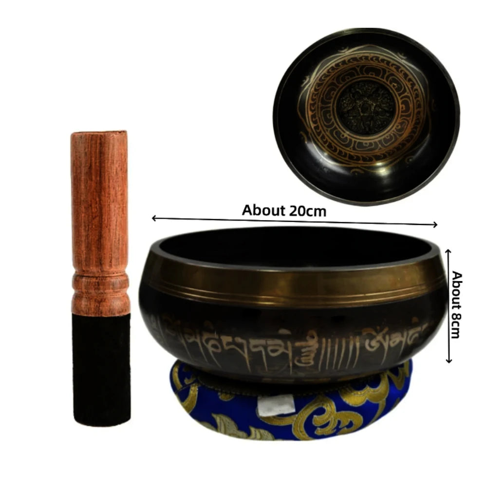 Handcrafted Tibetan singing bowl with a wooden striker and blue cushion