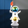 Handcrafted astronaut figurine resin spaceman desk decor with a fiery plume
