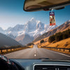 A hanging car air freshener with assorted scents is visible inside a car cabin.