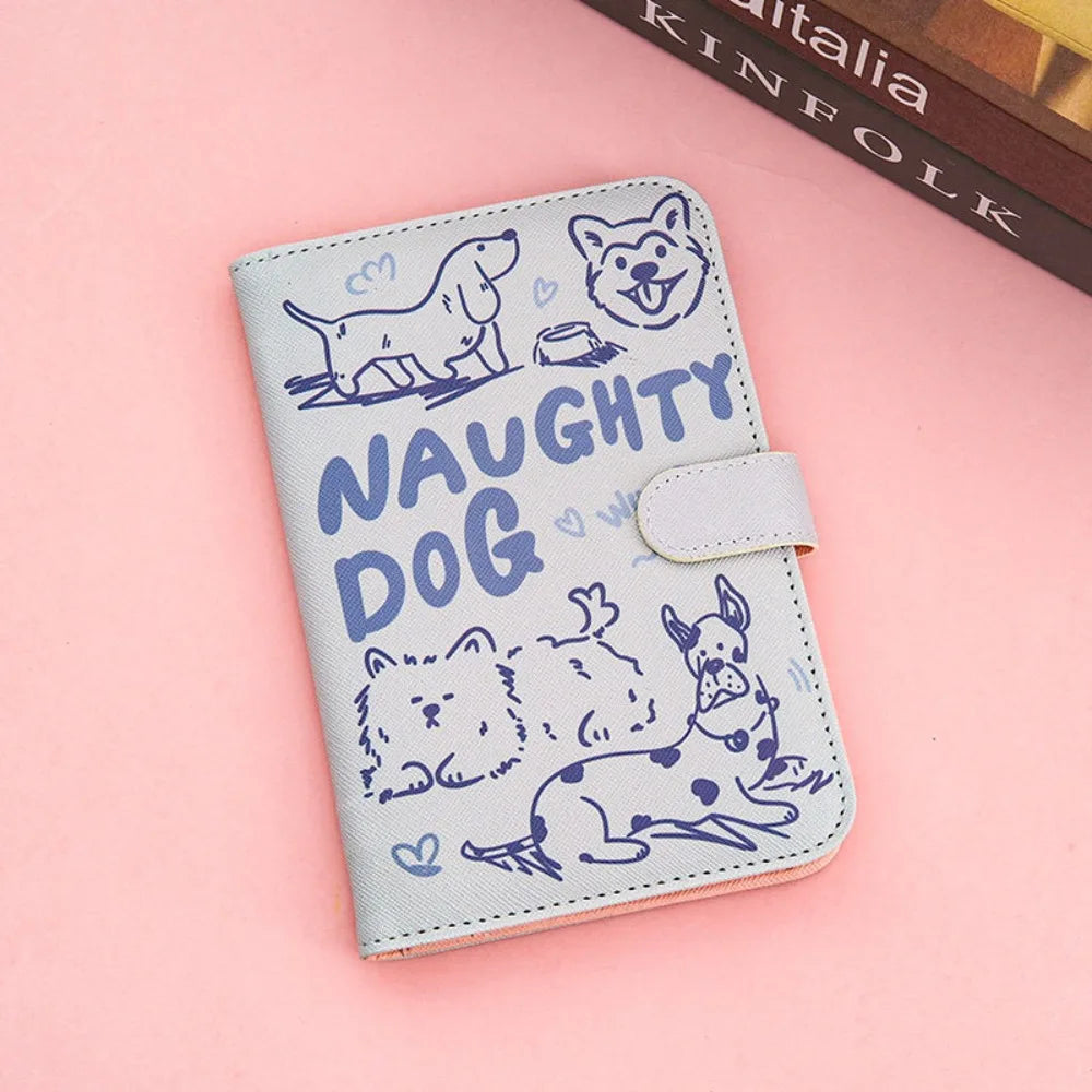 A light blue leather passport holder featuring a cartoon dog design on a pink background.