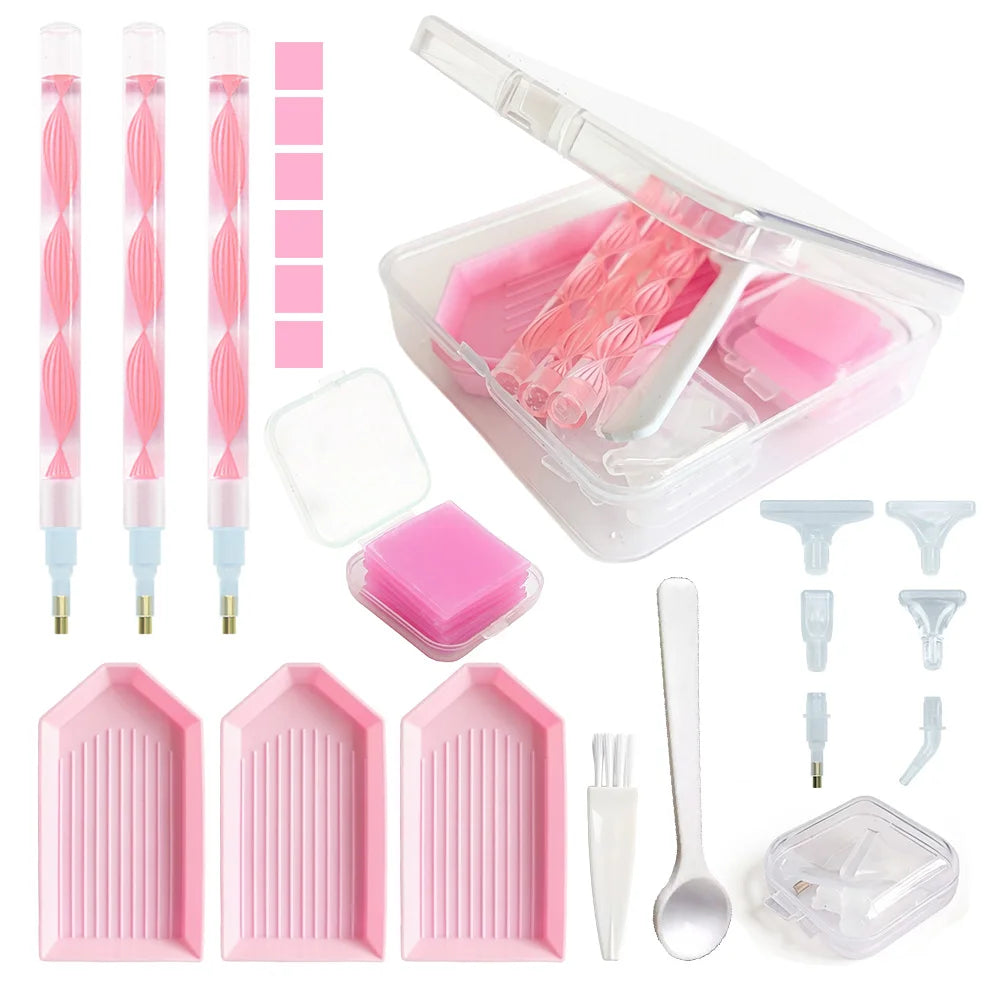 A complete diamond painting accessory kit featuring tools, pink storage box, and pink plastic tiles.