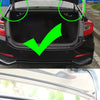 A close-up view of a car trunk with an installed universal adjustable lift spring kit.