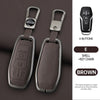 A brown leather key case with a metal key chain and four buttons shown next to the product.